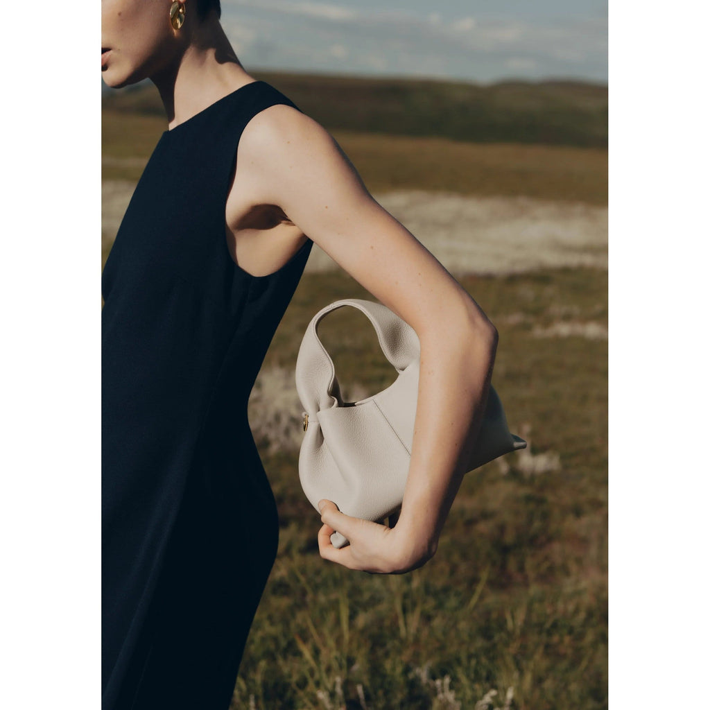 Vega – Bolso de mano minimalista